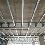 Light gauge steel ceiling framing grid installed against a concrete slab in a commercial building in Ontario